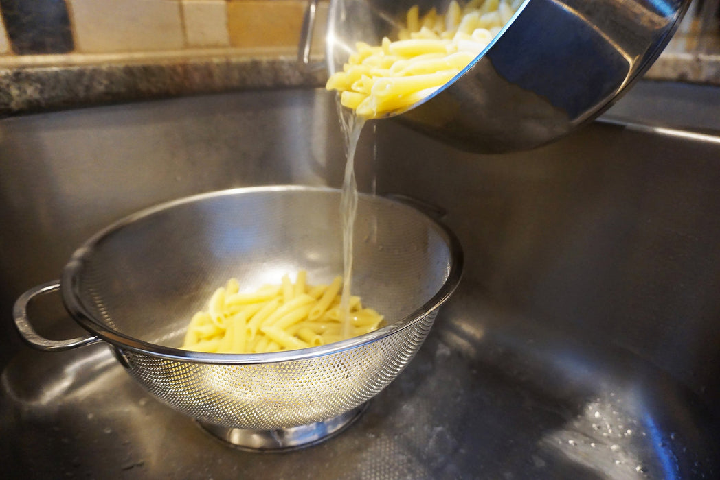 Colander showing pierced drainage holes detail