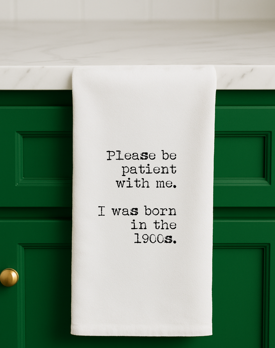 Born in the 1900s funny gift towel styled in kitchen