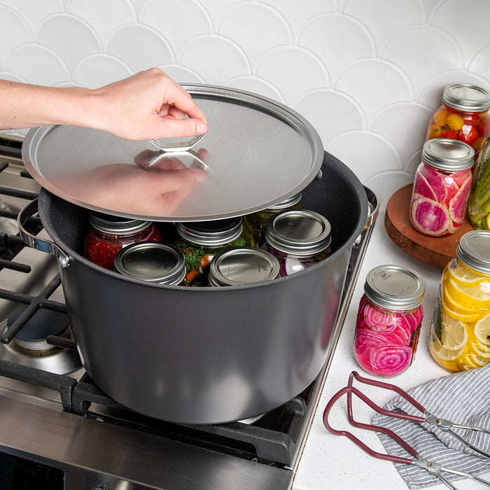 Verde 16 qt stock pot on the stovetop filled with canning jars