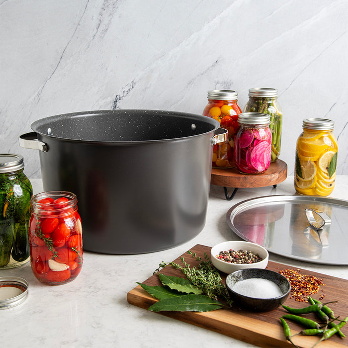 Verde 16 qt stock pot surrounded by jars of home-canned vegetables