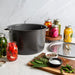 Verde 16 qt stock pot surrounded by jars of home-canned vegetables