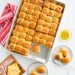 Big Batch Pan filled with baked ham and cheese sliders