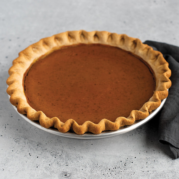 Nordic Ware Naturals High Dome Covered Pie Pan with pumpkin pie
