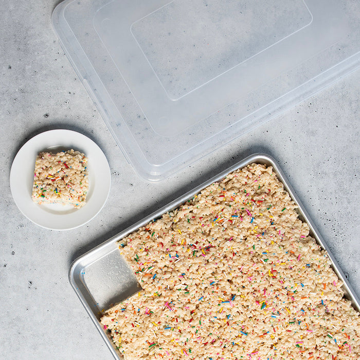 Rice crispy treats in the sheet pan with one square plated