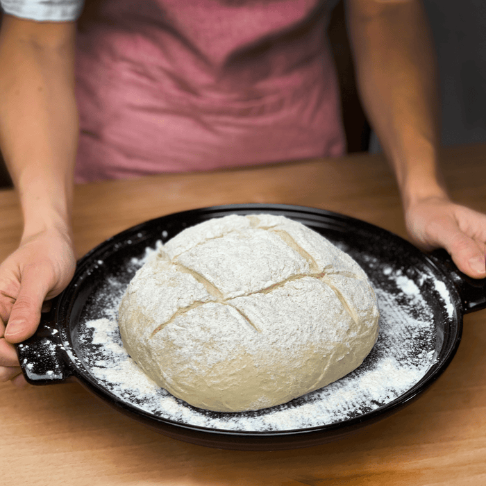Emile Henry Bread Cloche in Charcoal — lifestyle, sliced bread