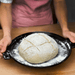 Emile Henry Bread Cloche in Charcoal — lifestyle, sliced bread