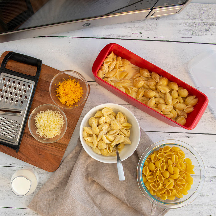 Microwave pasta cooker filled with creamy mac and cheese
