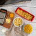 Microwave pasta cooker filled with creamy mac and cheese
