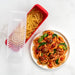 Overhead view of the pasta cooker with cooked pasta