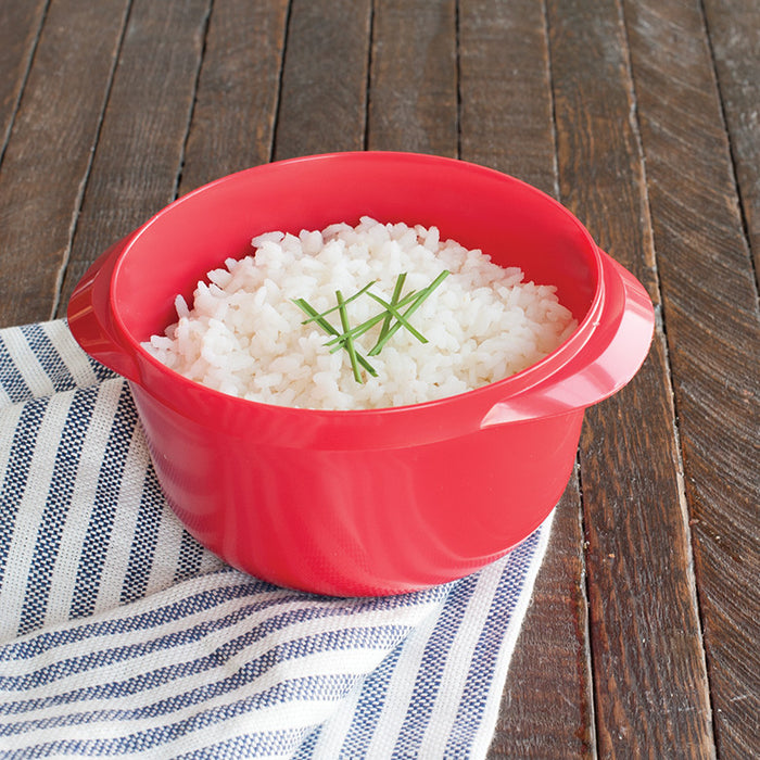 Microwave multi boiler filled with cooked white rice