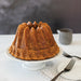Golden Bundt cake baked in the Kugelhopf pan showing the swirled fluted design