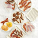 Nordic Ware bacon trays holding bacon strips and sausage