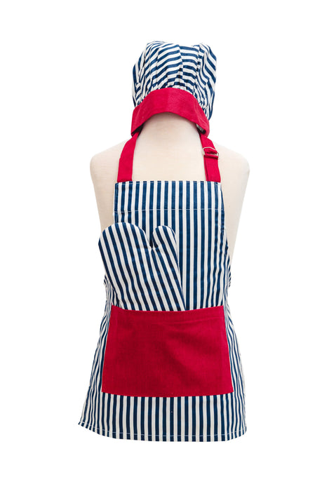 Child wearing striped apron and chef hat