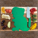 Dinosaur-shaped cutting board with kid-safe knife