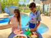 Child using Dinosaur Cutting Board & Knife Set