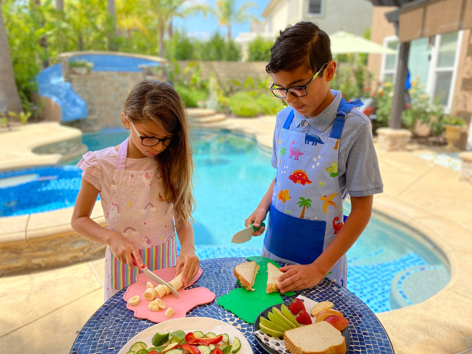 Child using Dinosaur Cutting Board & Knife Set